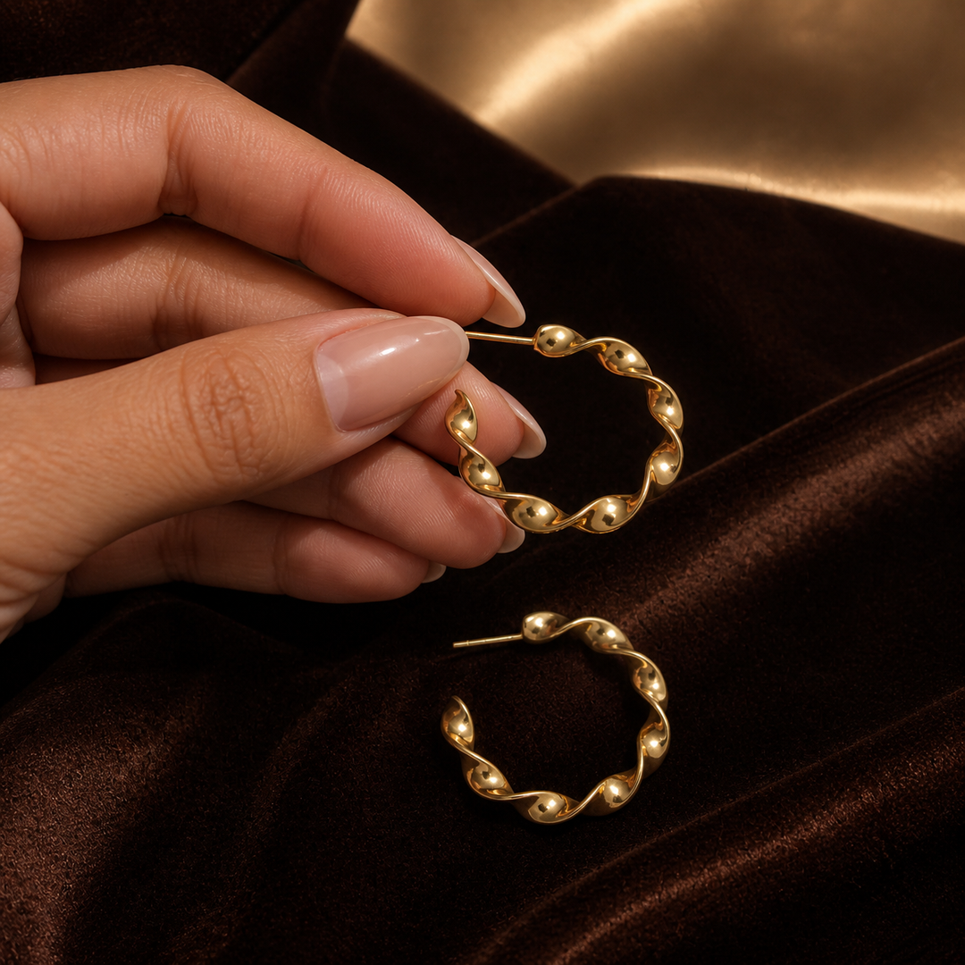 Spiral Twisted Hoop Earrings - Gold-Plated Brass - hand-held scale view - Tarashya Jewels