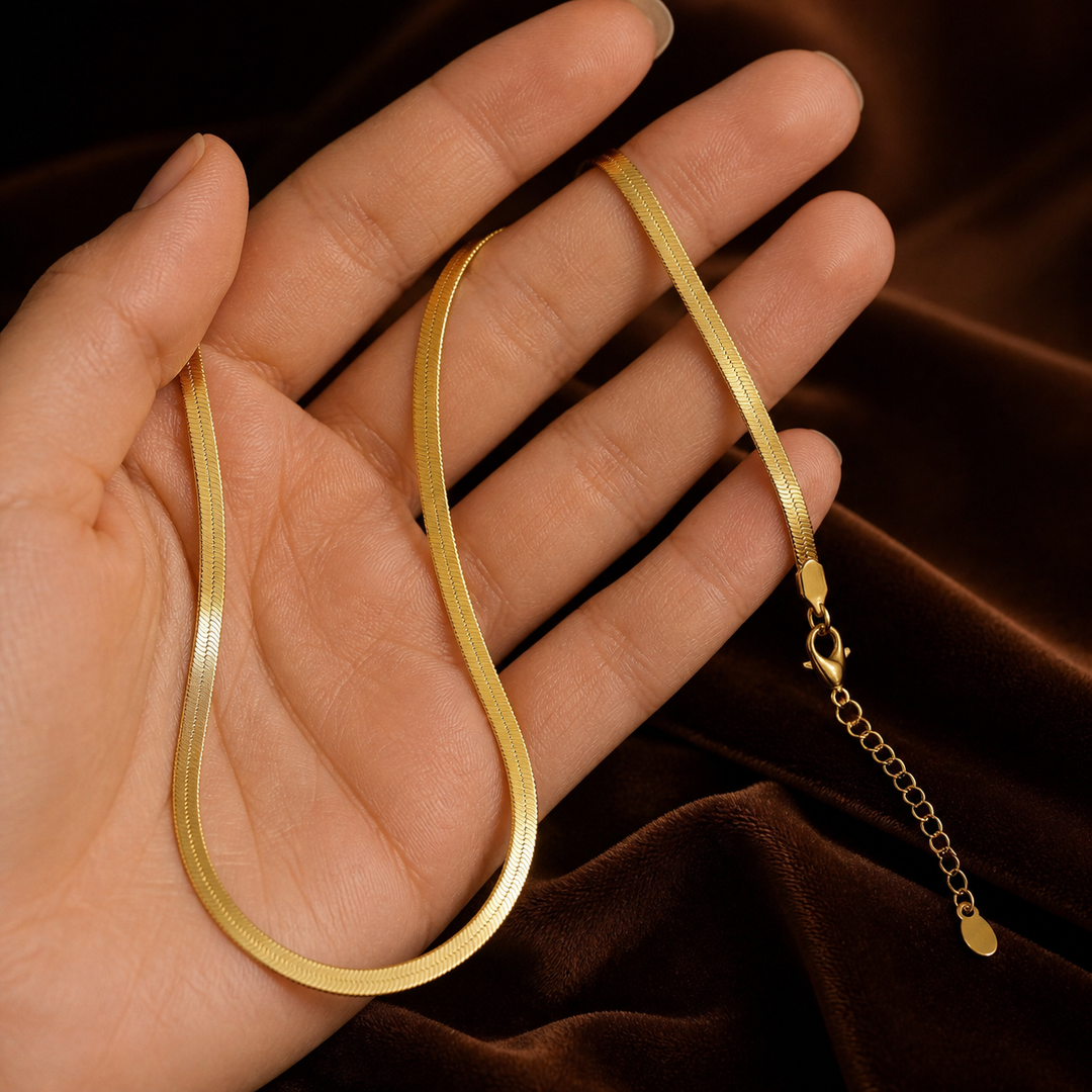 3 mm Flat Snake Chain - Brass - hand-held scale view - Tarashya Jewels