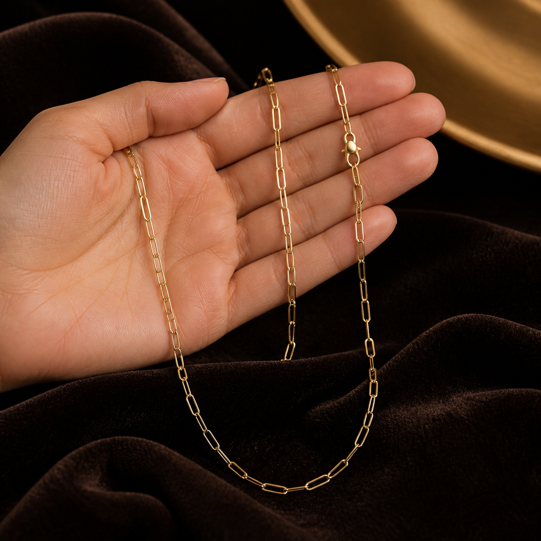 1.2 mm Round Paperclip Chain - Brass - hand-held scale view - Tarashya Jewels