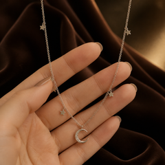 Star & Moon Necklace - 925 Sterling Silver - hand-held scale view - Tarashya Jewels