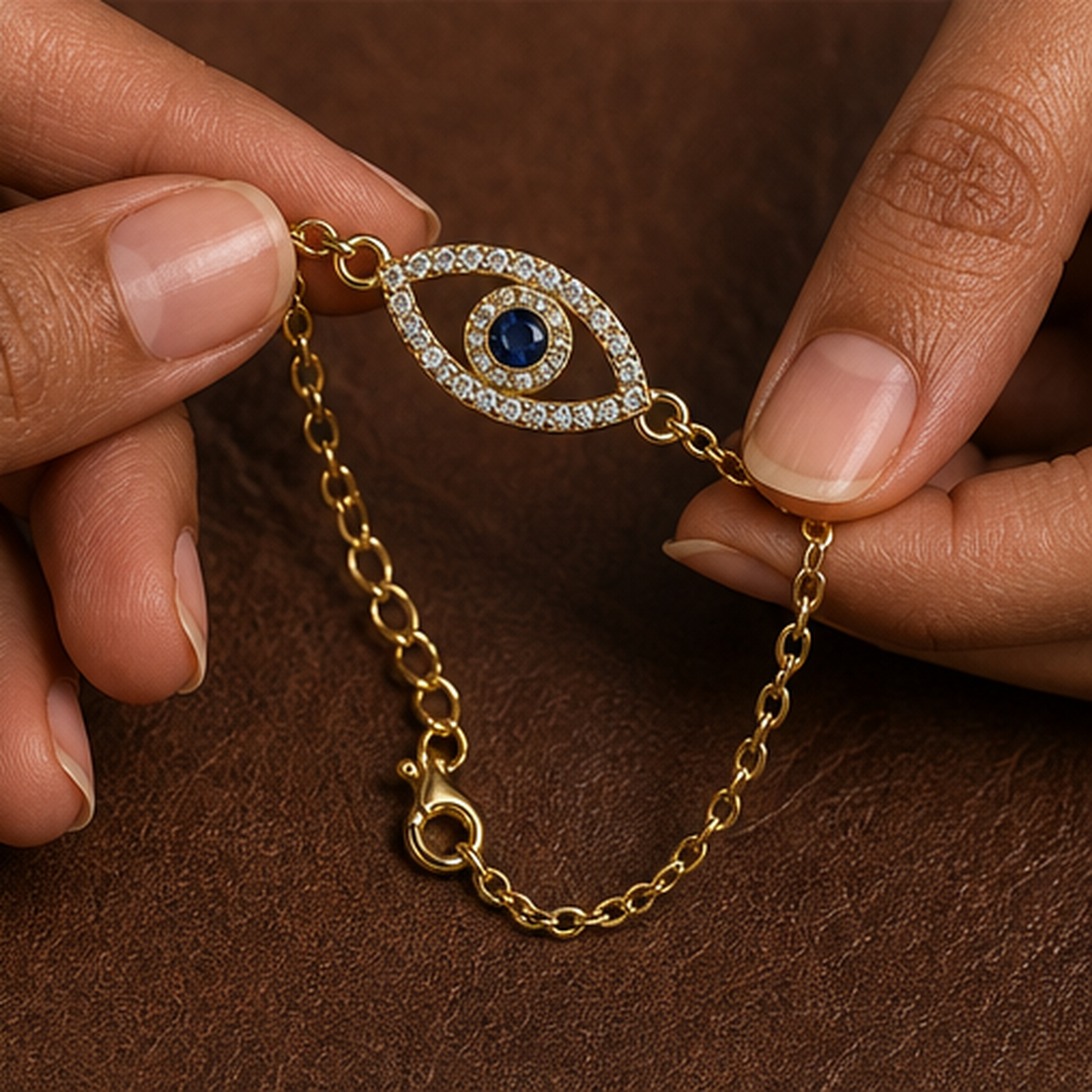 Evil Eye Bracelet - Brass - hand-held scale view - Tarashya Jewels