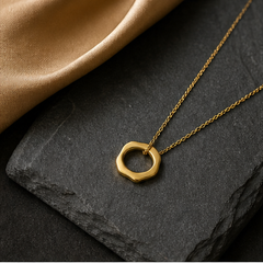 Eternity Pendant Necklace - Brass - flat lay - Tarashya Jewels