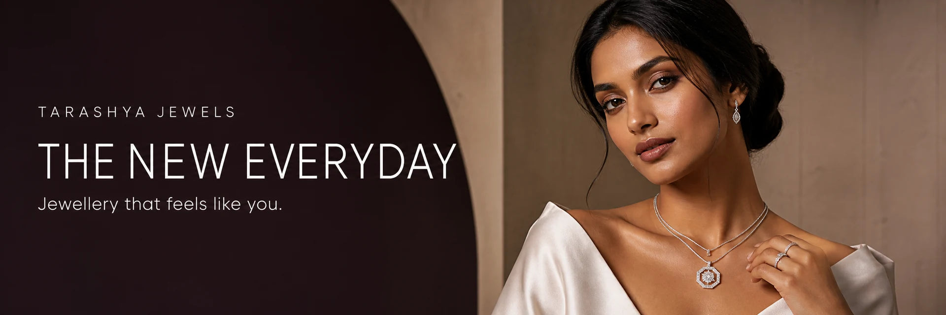 Contemporary Indian model wearing layered silver jewellery and a pendant